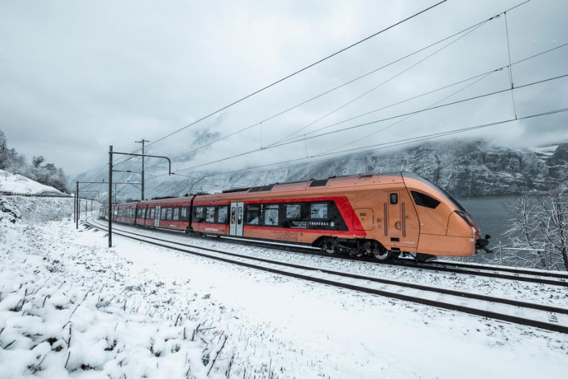 Sudostbahn train through snowy landscape