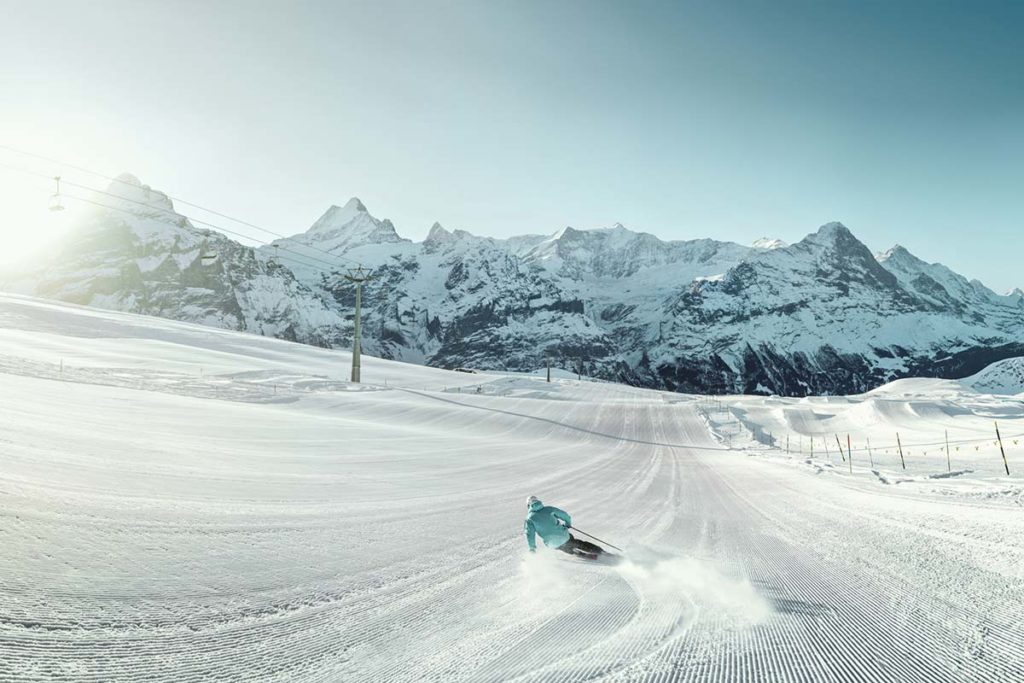Skier on a wide, quiet piste in Grindelwald, Switzerland